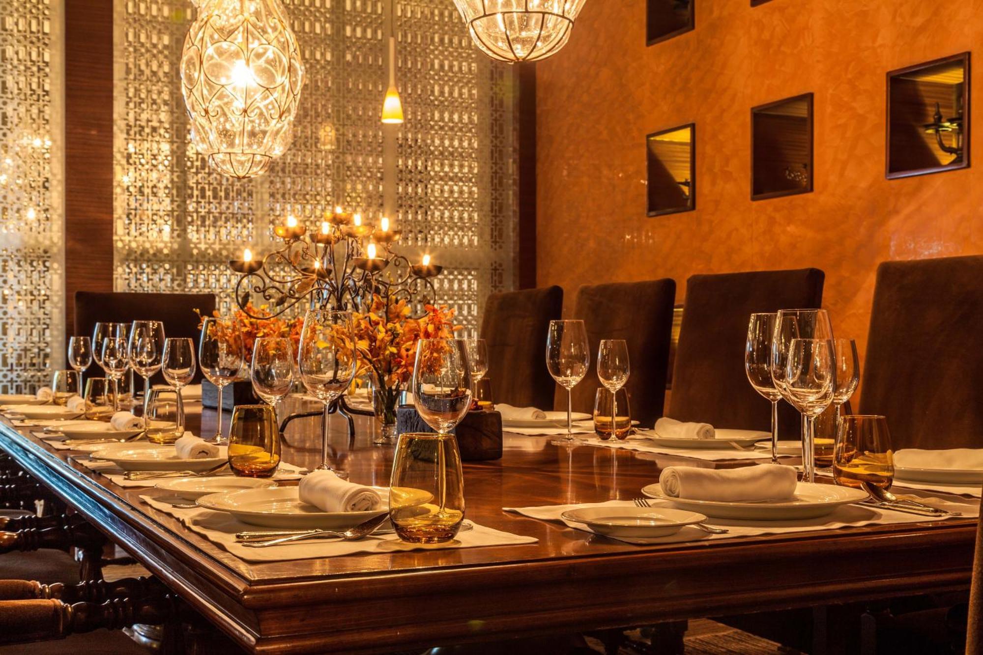 The Leela Ambience Gurugram Hotel & Residences - The Luxury Urban Sanctuary Γκουργκάον Εξωτερικό φωτογραφία A dining room table set for a meal